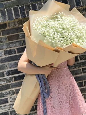 White lilies hand bouquet
