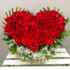 heart shaped arrangement of red roses in basket