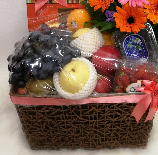 dav basket of mixed flowers & fruits with boxes of chocolate