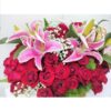 roses lilies in basket arrangement