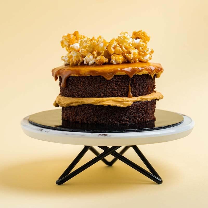 sunflower bouquet with cake, wine, and chocolate