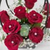 stunning arrangement of classic red roses with diamond pin