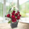stunning arrangement of classic red roses with diamond pin